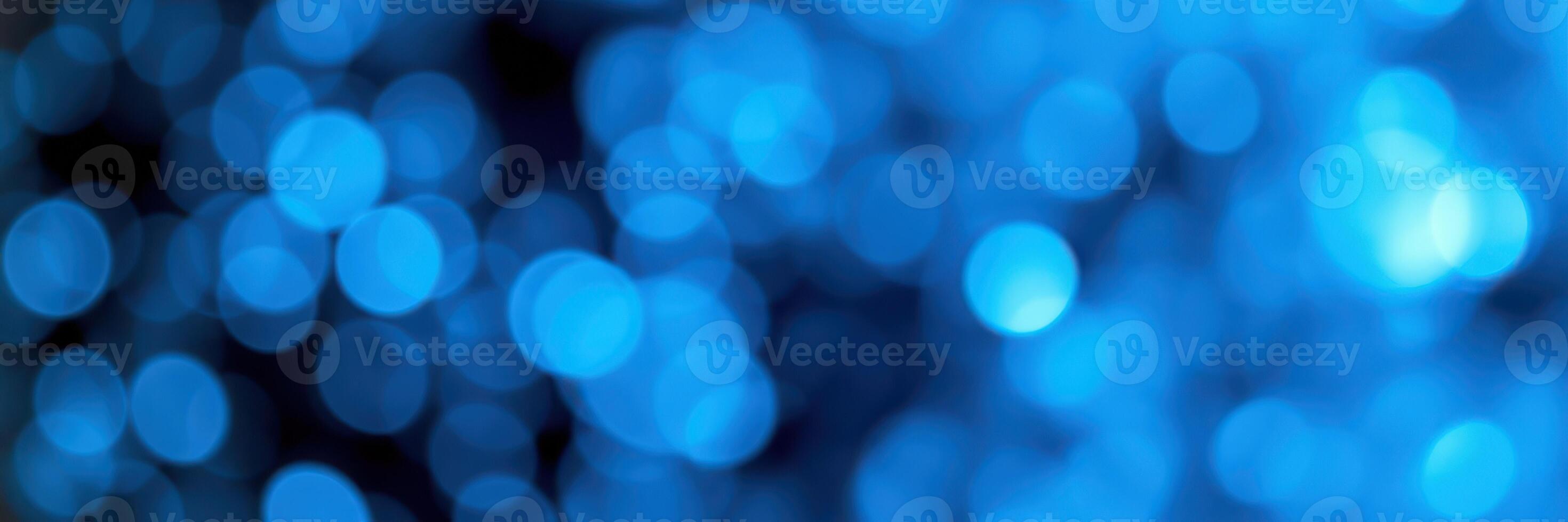 Abstract blue bokeh background created by soft light and blurred circles photo