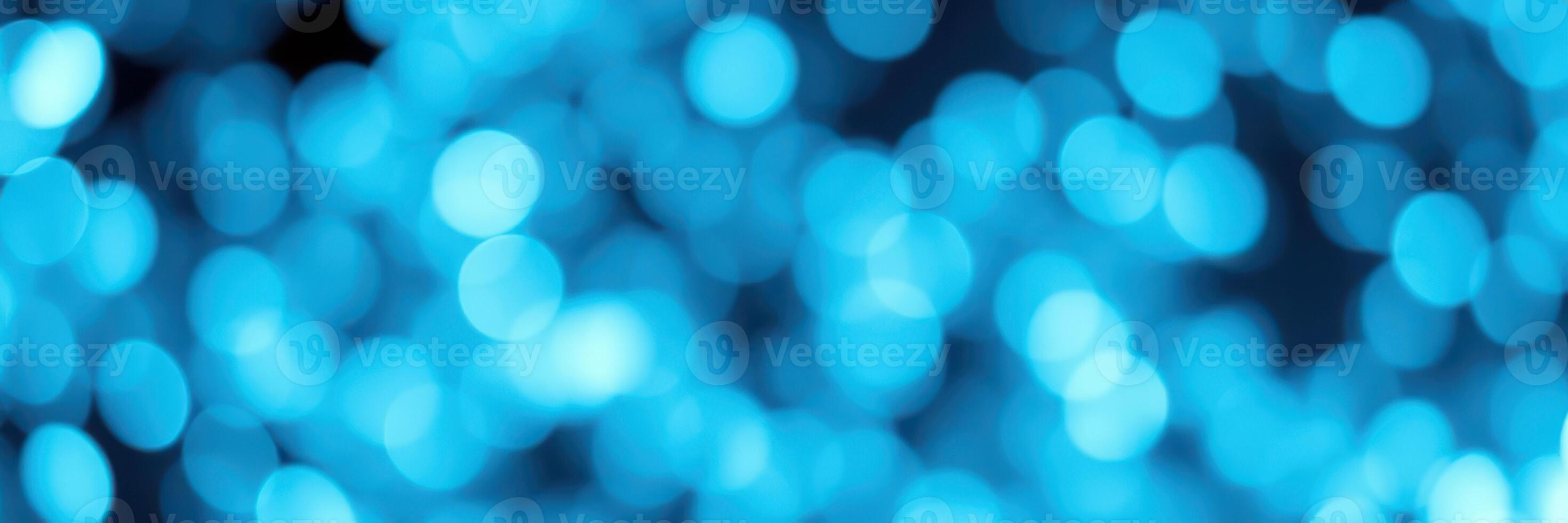 Vibrant blue bokeh lights create a captivating backdrop in an abstract display of color and texture photo