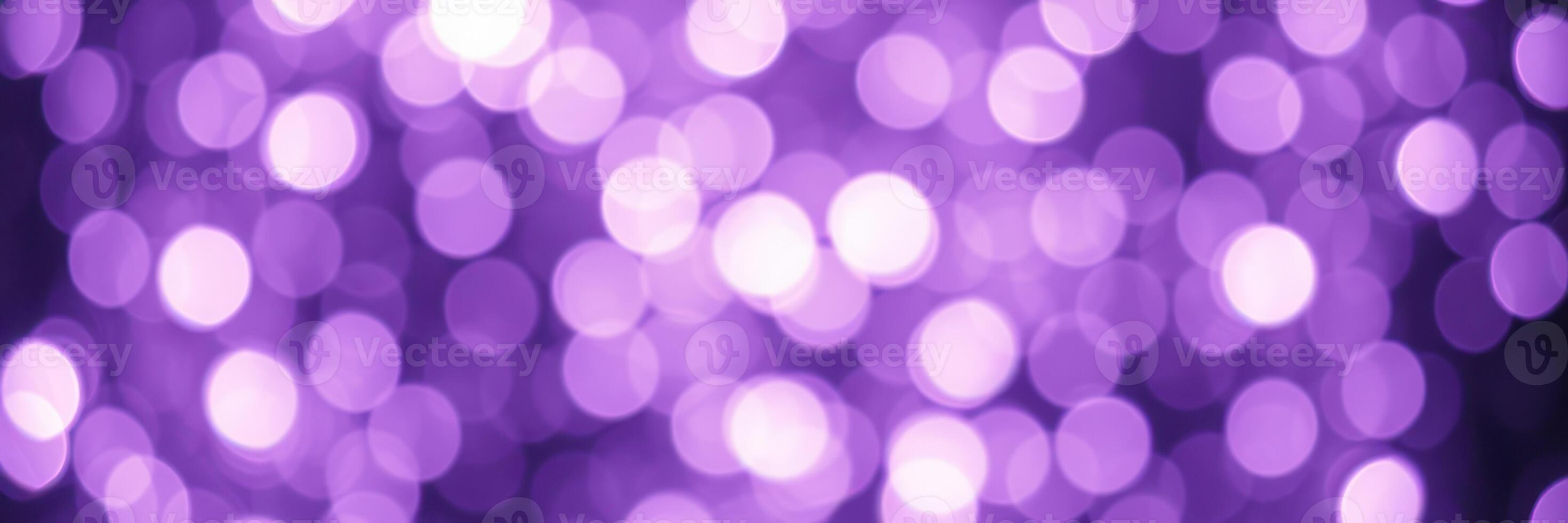 Beautiful purple bokeh lights creating a dreamy atmosphere at a festive event during the evening hours photo
