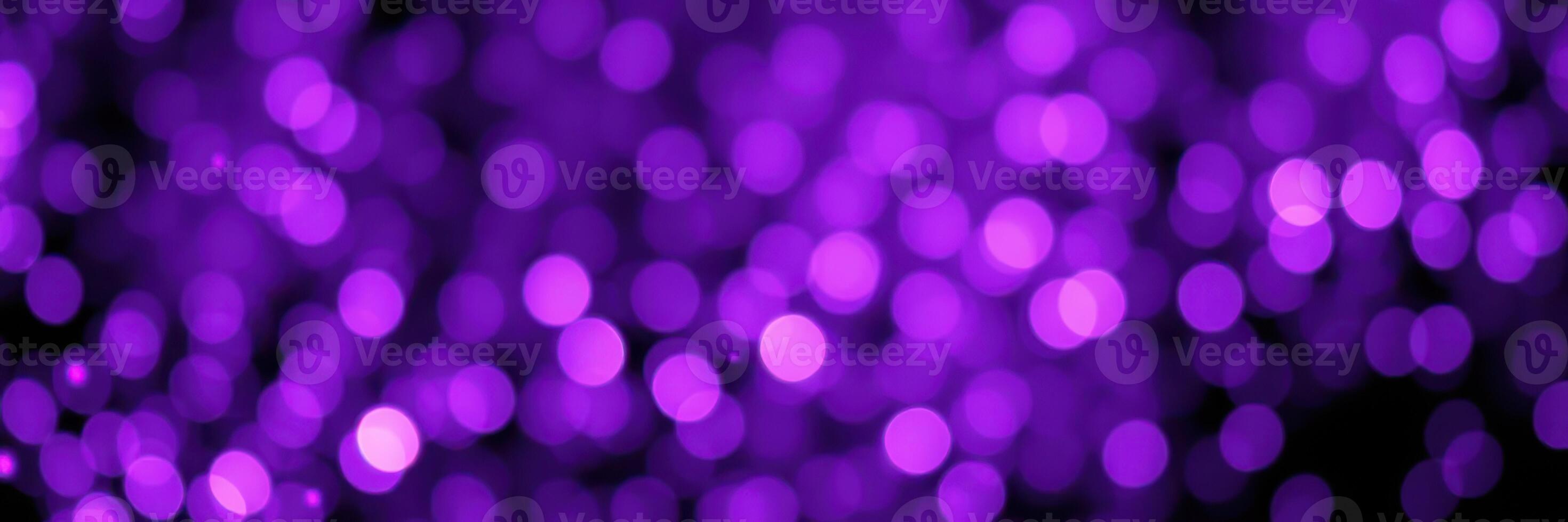 Colorful purple bokeh lights create a vibrant festive atmosphere during a special nighttime celebration photo