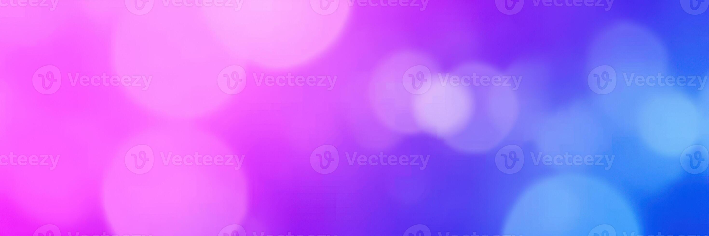 Colorful light bokeh effect with vibrant pink and blue hues during an evening event photo