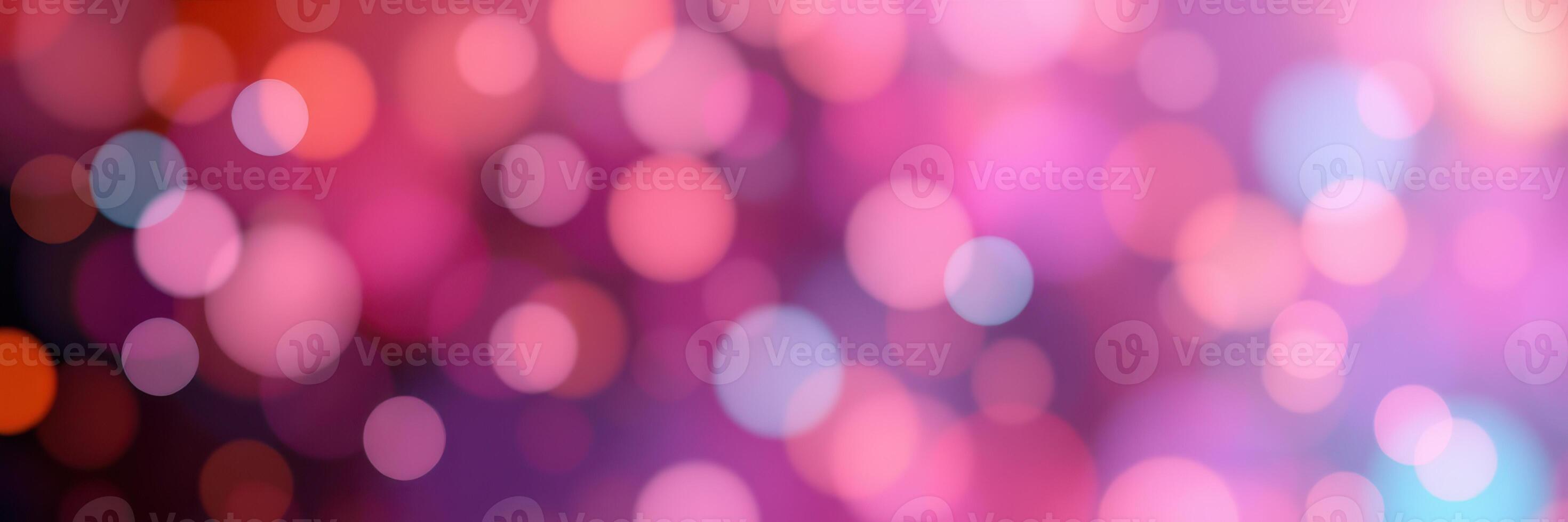 Soft bokeh lights create a magical atmosphere with pink and purple tones for a festive occasion photo