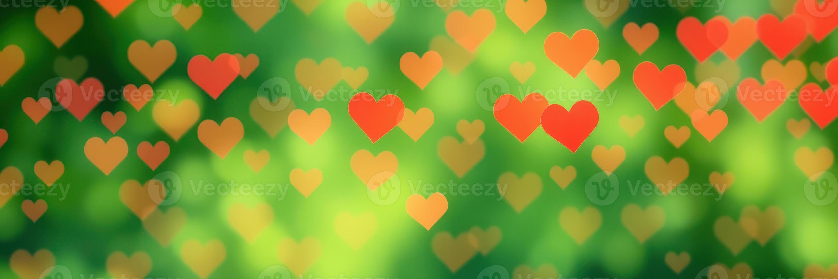 Colorful hearts float against a blurred green background creating a whimsical and romantic atmosphere photo