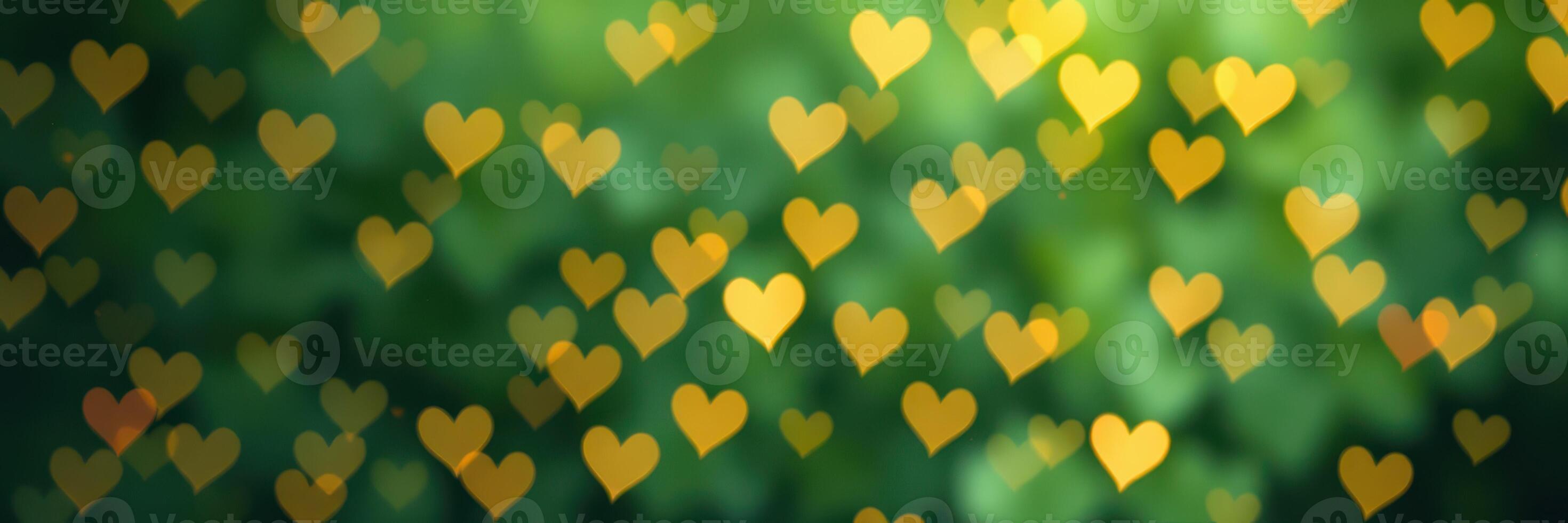 Warm golden hearts create a beautiful bokeh effect against a green background during springtime photo