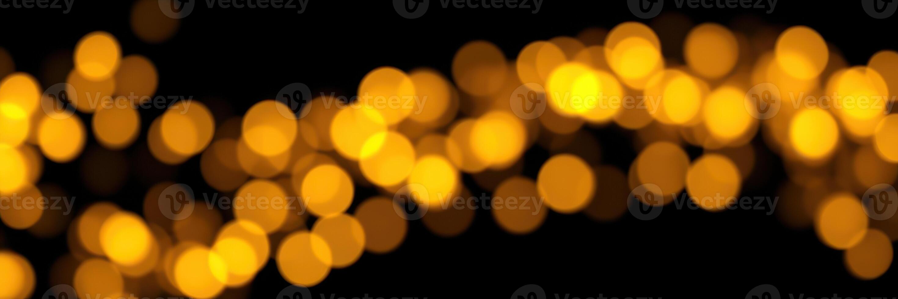 Glowing yellow bokeh lights create a warm atmosphere for celebrations during evening events in the city photo