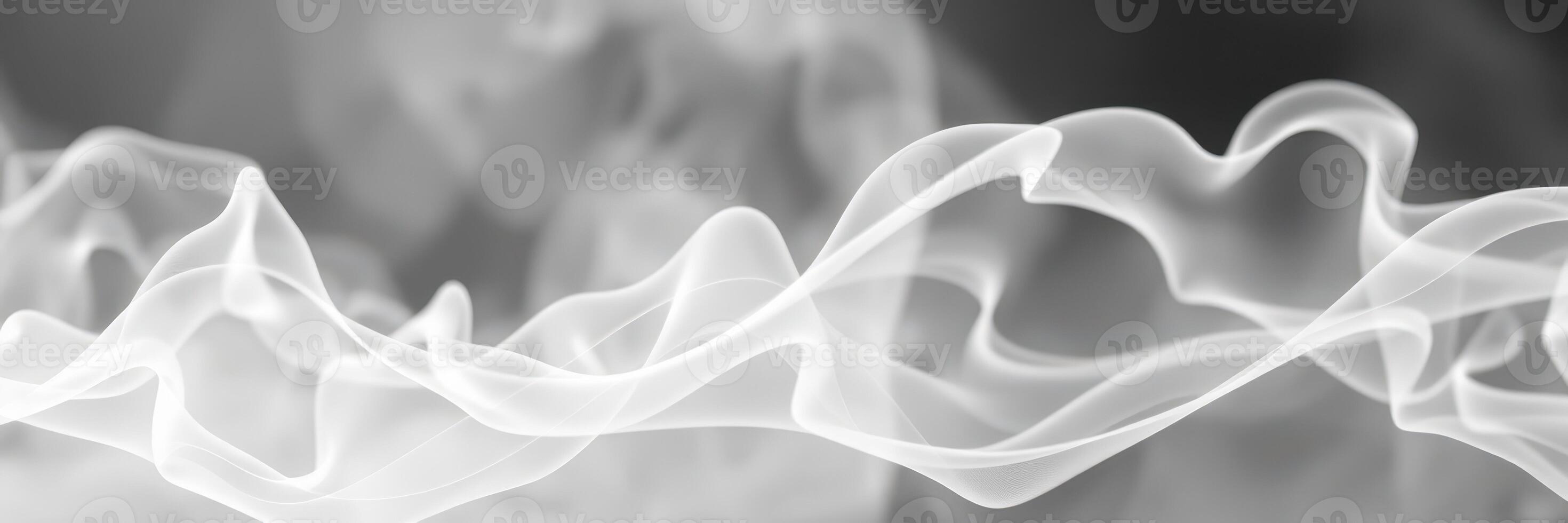 Silky white smoke swirls creating abstract patterns in a dark background captured during a creative photography session photo