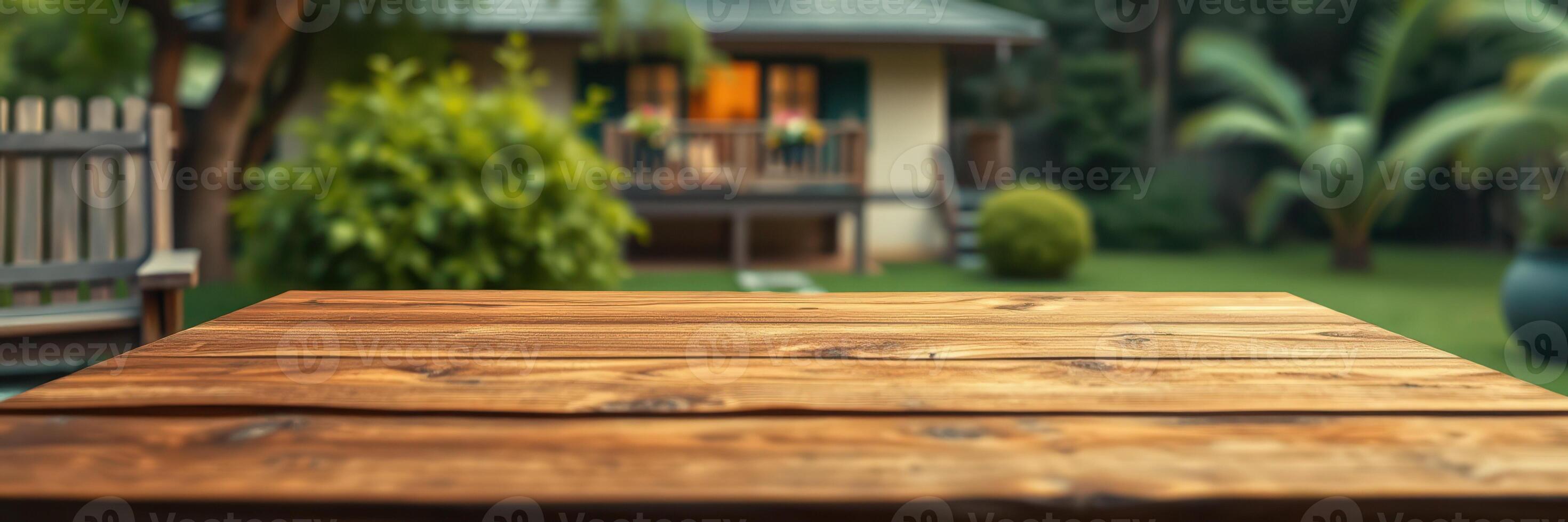 Wooden table in a serene backyard during a warm afternoon surrounded by lush greenery and a cozy home photo
