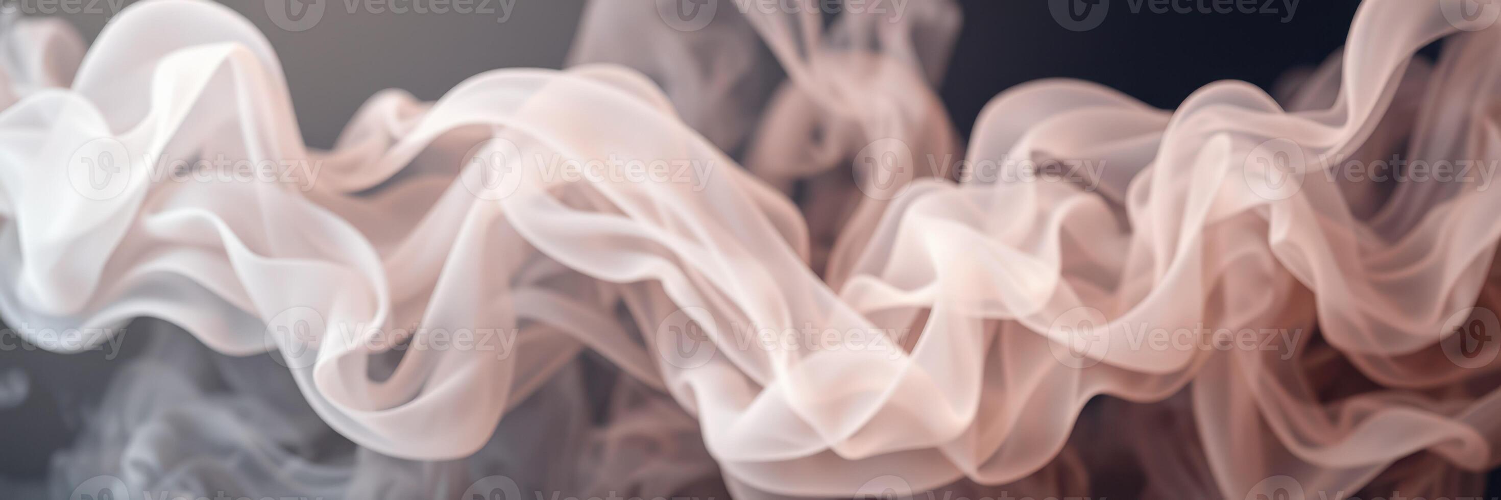 Elegant swirls of smoke dancing in soft light during a creative art session on a calm evening photo