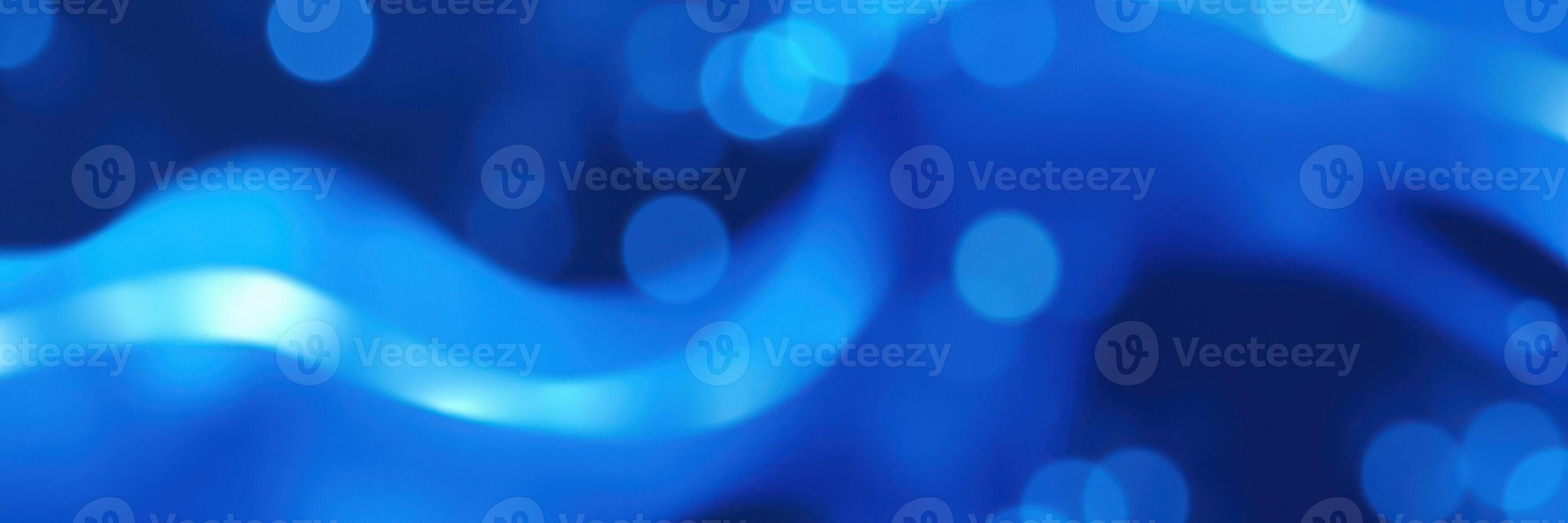 Colorful blue waves create an abstract pattern resembling fluid motion and depth in water or a digital environment photo