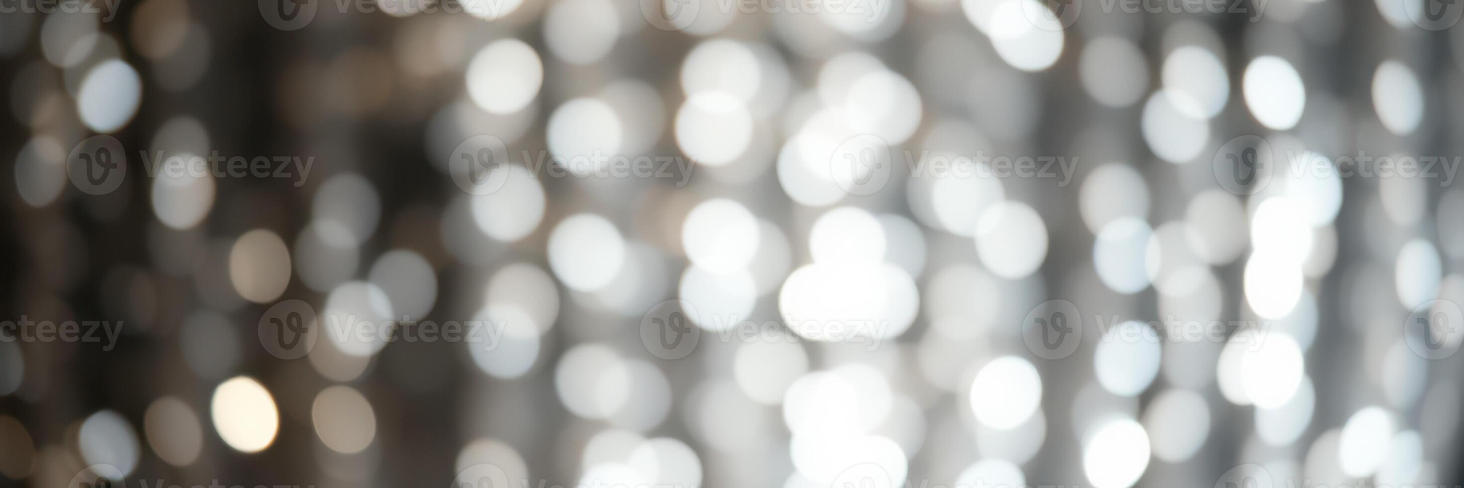 Sparkling bokeh lights create a magical atmosphere for a festive celebration in an indoor venue during the evening hours photo