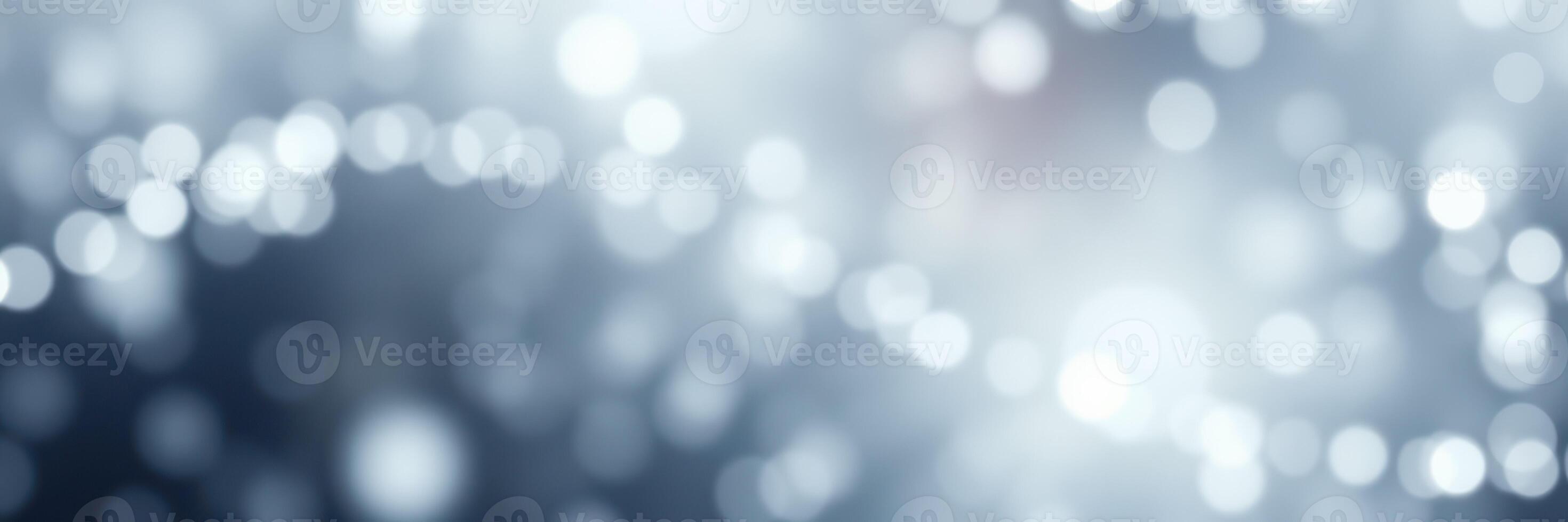 Soft blue and white bokeh lights create an ethereal atmosphere in a blurred background setting photo