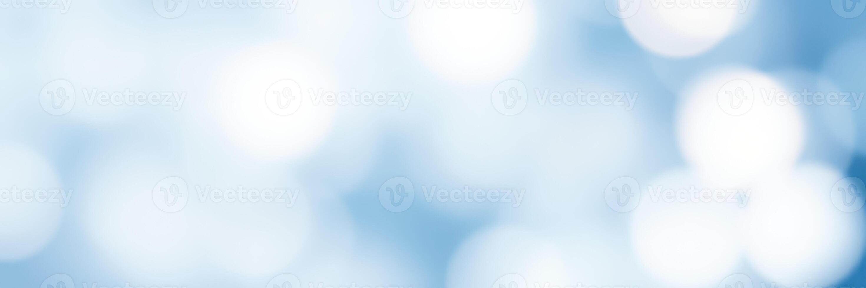 Soft blue bokeh background creates a serene and calming atmosphere for various design uses photo