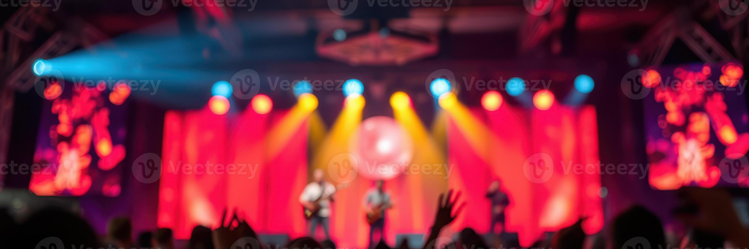 Vibrant concert featuring a lively band performing on stage with colorful lighting photo