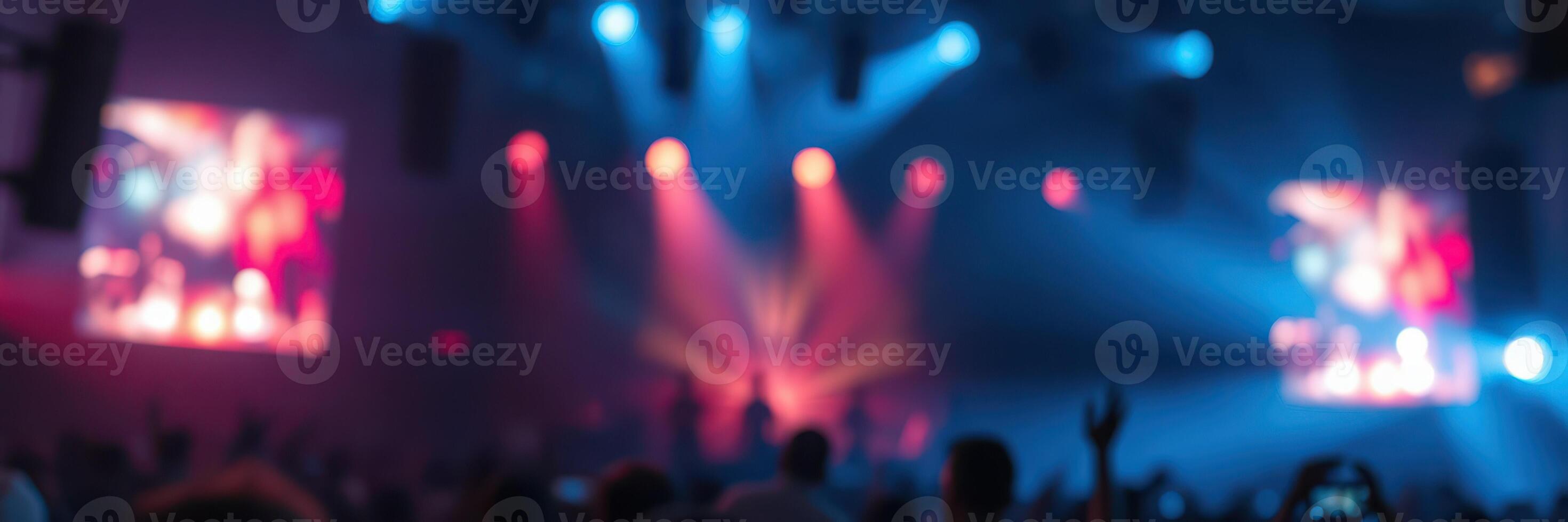 Lights and energy fill the venue during a dynamic live music performance at night photo