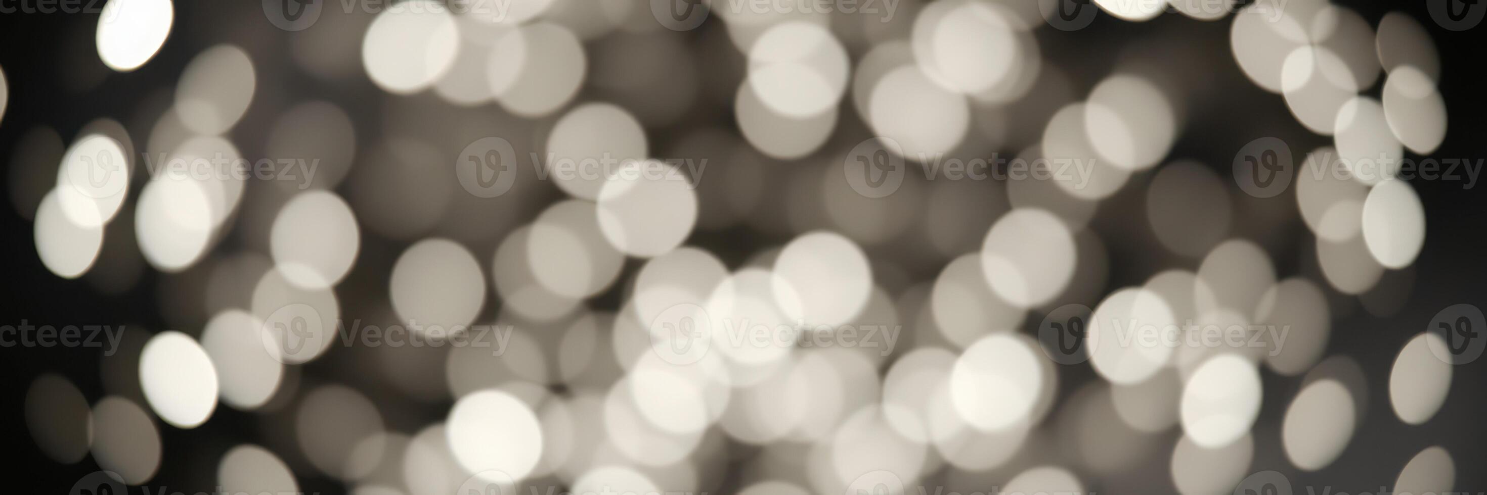 Soft blurred bokeh lights create a dreamy atmosphere for a cozy indoor gathering or festive celebration photo