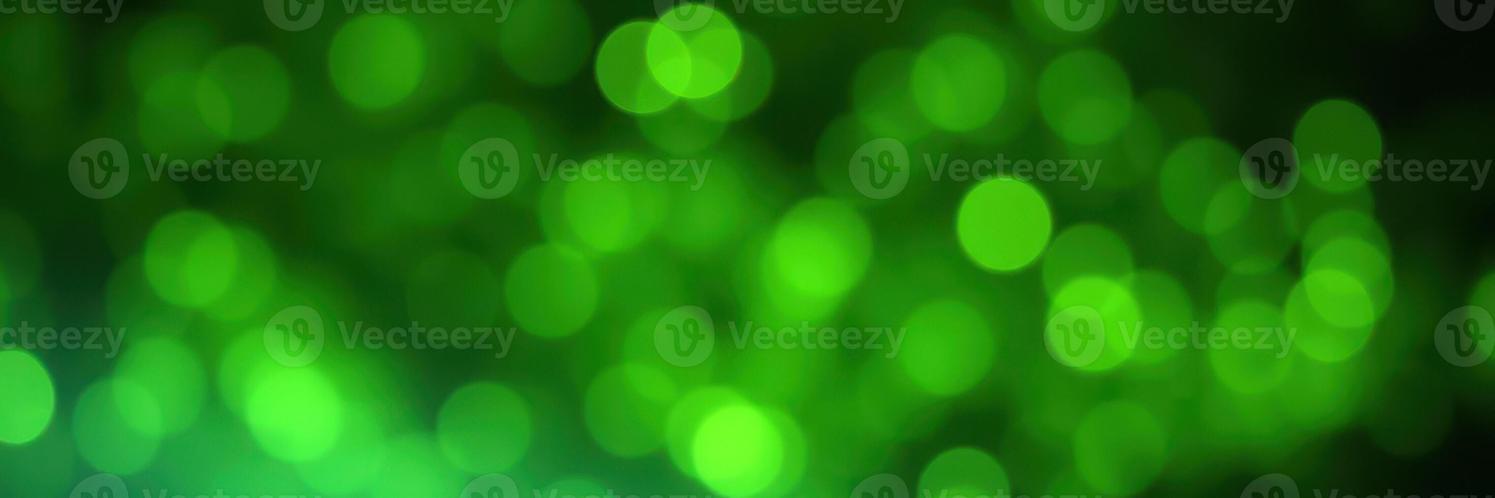 Vibrant green bokeh lights create a magical atmosphere in a festive setting during the evening photo