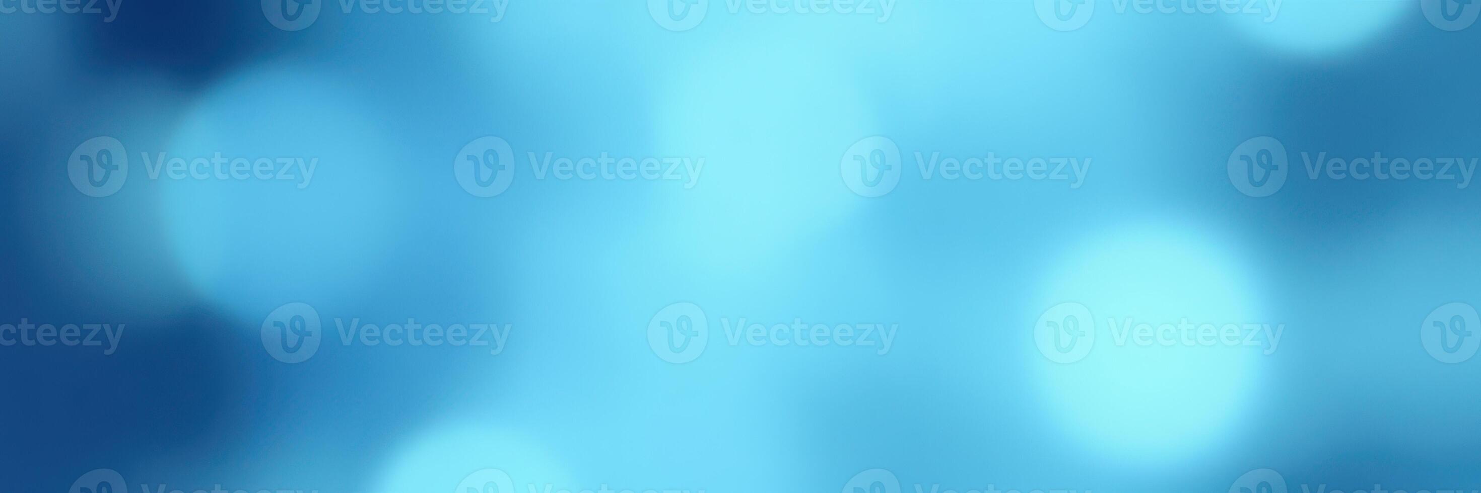 Soft blue background creates a calming atmosphere with gentle light reflections and smooth textures photo