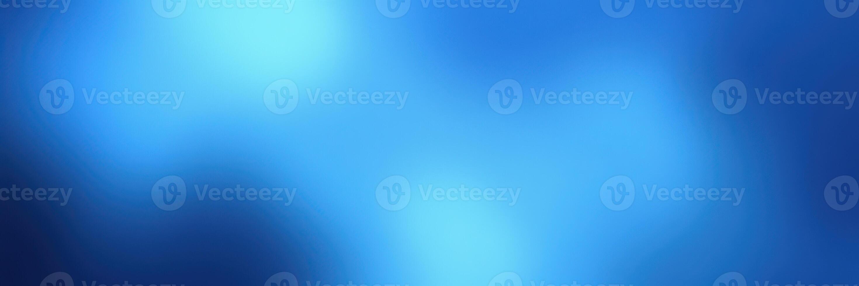 Soft blue abstract background with light variations creating a tranquil atmosphere suitable for design projects photo