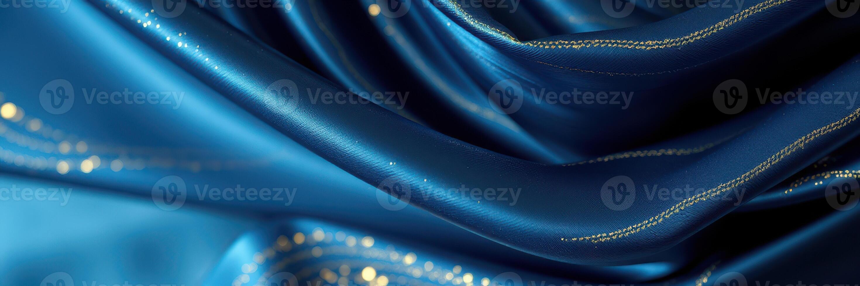 Elegant blue silk fabric with shimmering details creating a luxurious atmosphere for fashion or decor photo