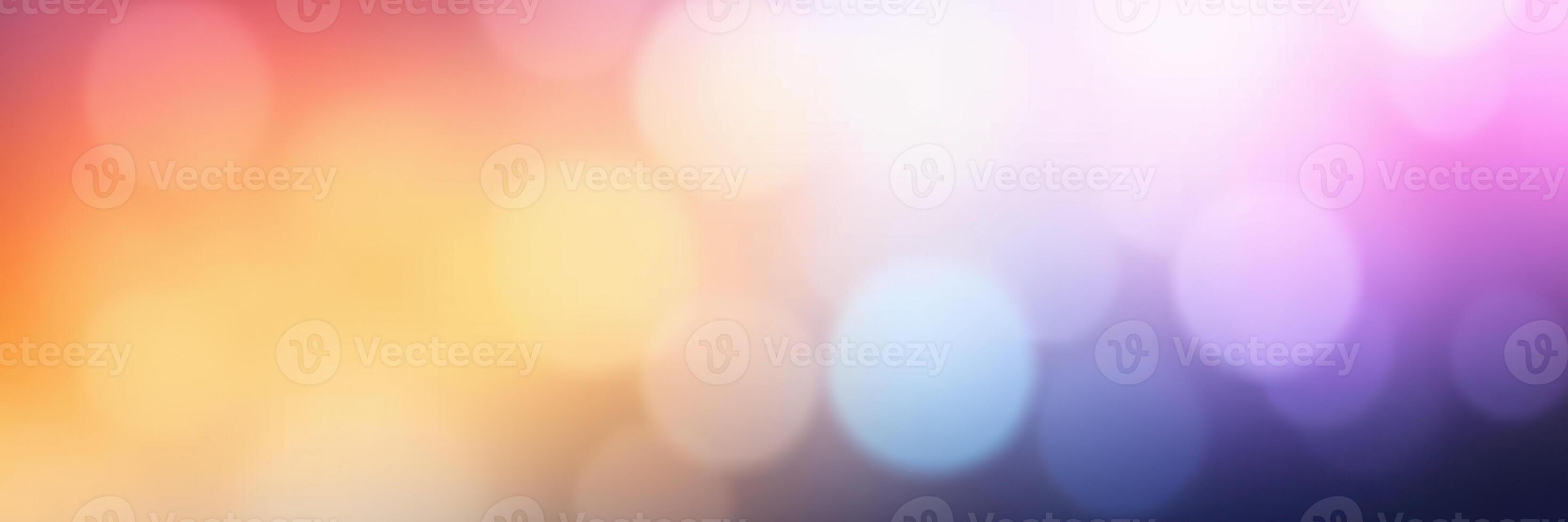 Vibrant abstract background with colorful light bokeh effect creating a cheerful atmosphere photo