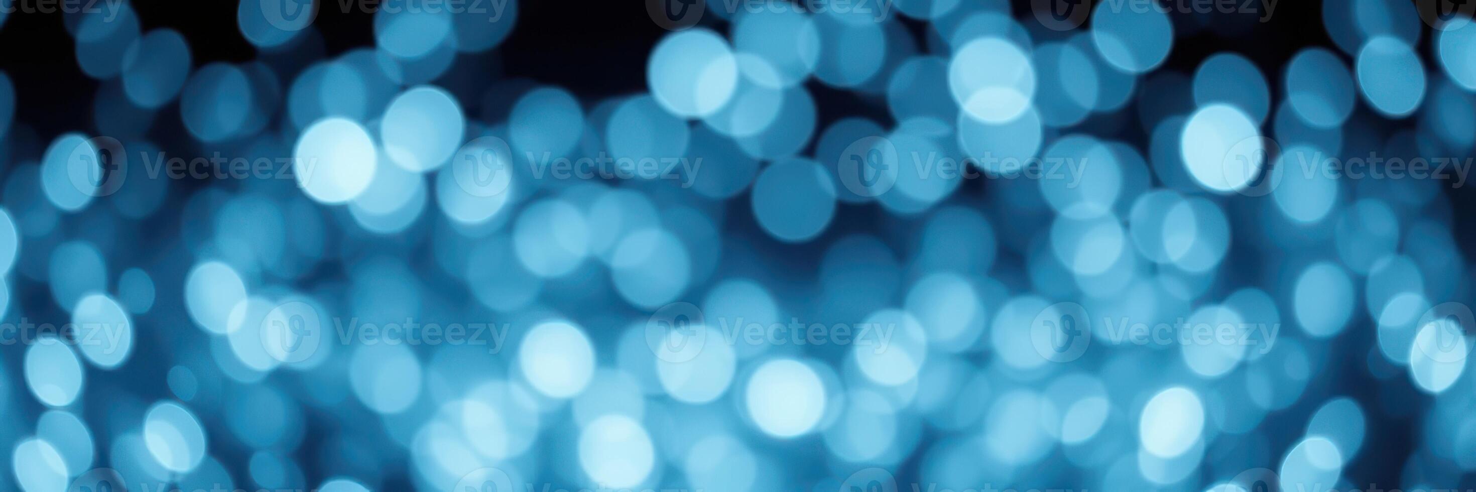 Beautiful blue bokeh lights create an enchanting atmosphere for celebrations and events at night photo