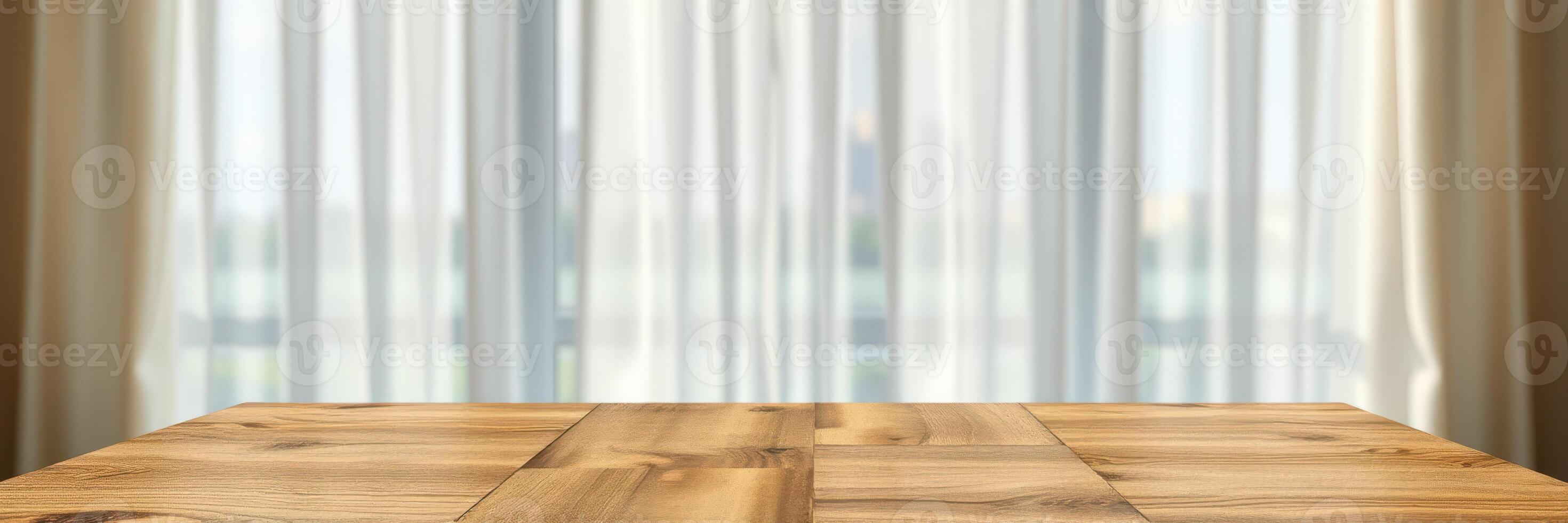 Sunlight filters through sheer curtains onto a wooden table in a modern indoor space during the day photo