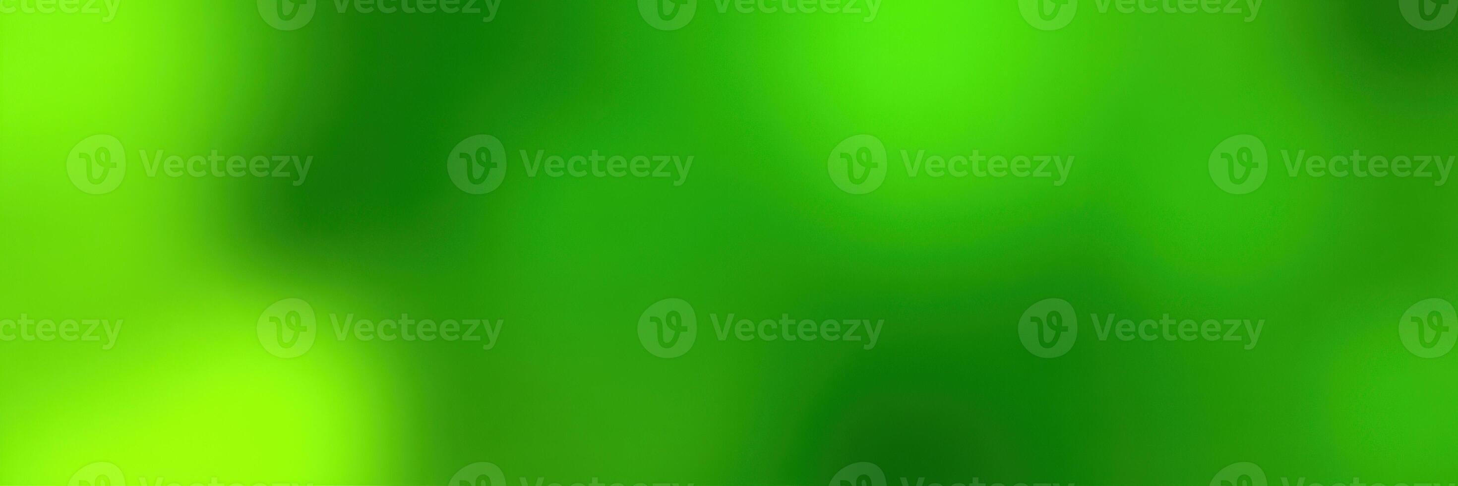 Vibrant green abstract background with soft blurred textures featuring a range of light and shadow effects photo