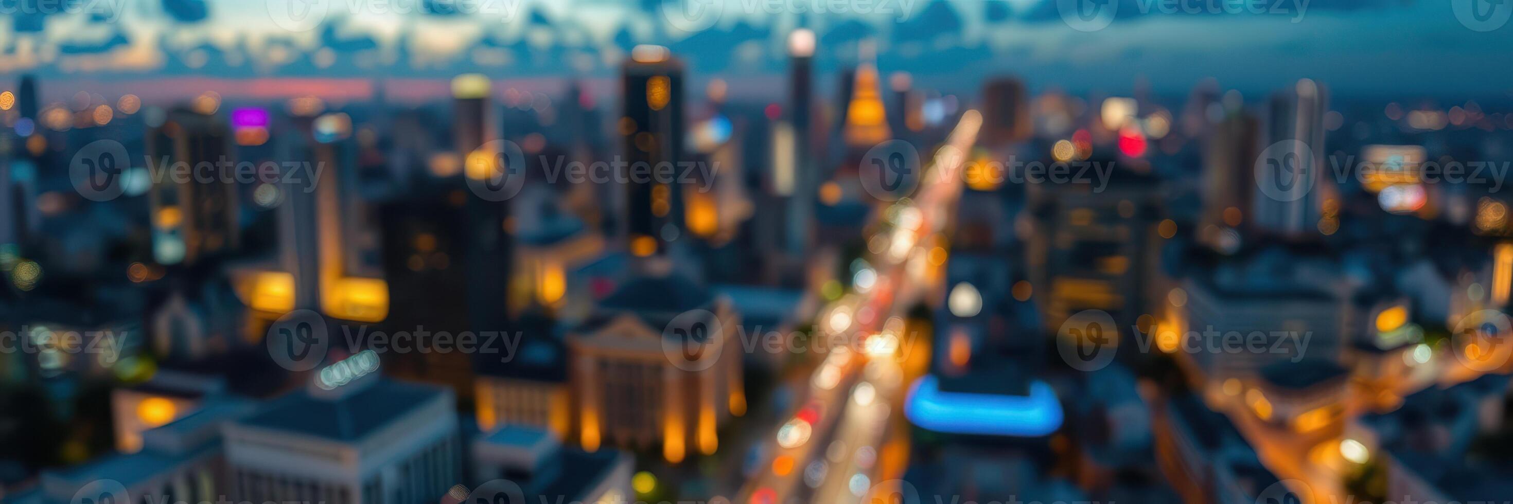 City skyline illuminated at dusk with traffic flowing through busy streets photo