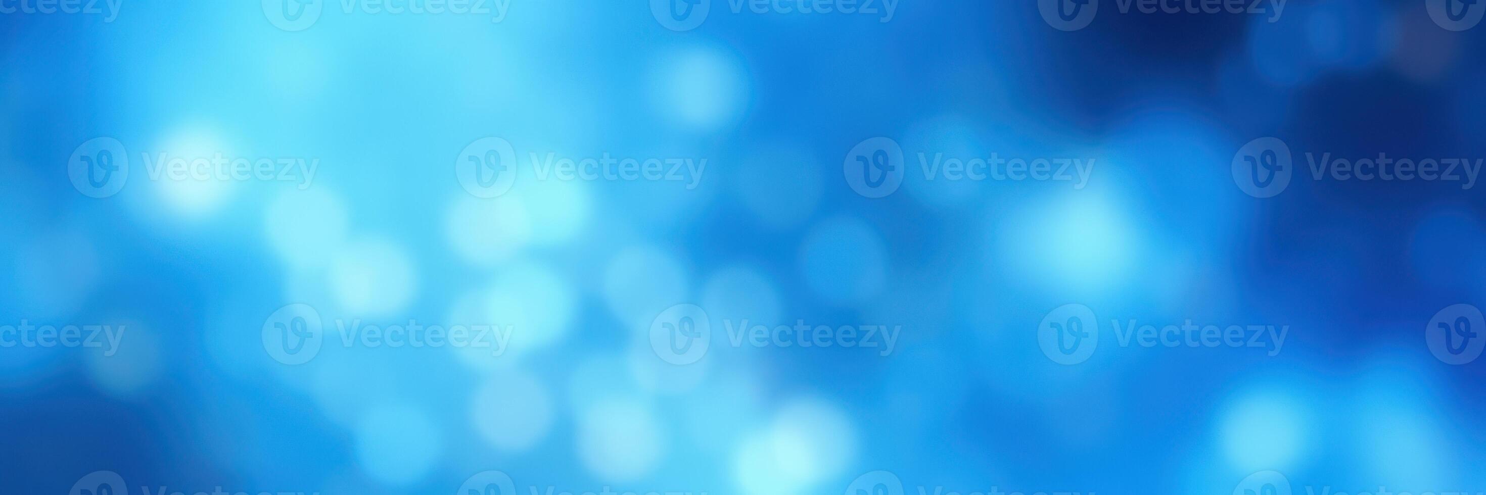 Soft blue bokeh background creates a calming atmosphere for design and art projects photo