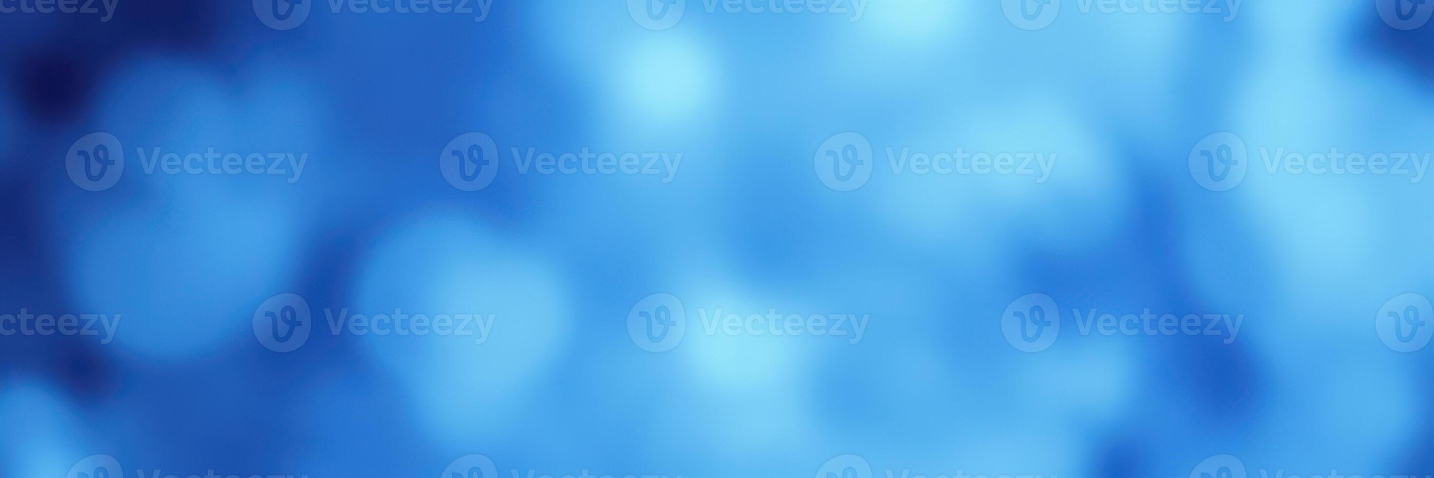 Beautiful blue abstract background with soft light emanating from various points at twilight photo