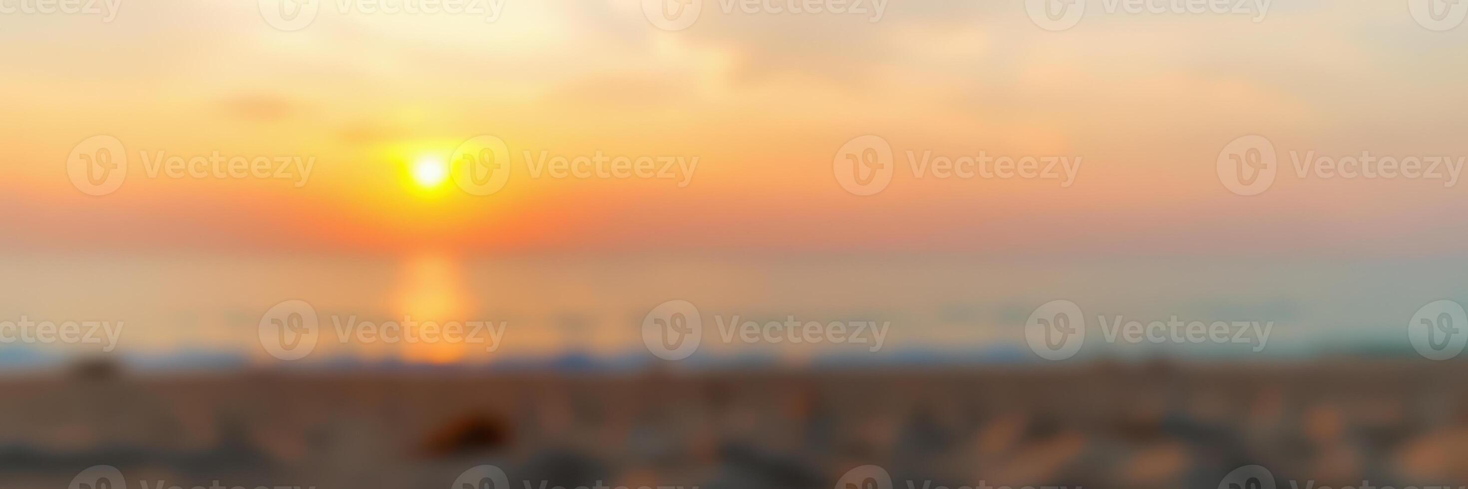 Stunning sunset over the ocean creates a serene atmosphere at the beach during twilight photo