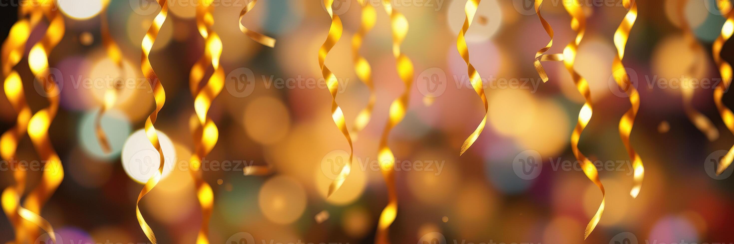 Shimmering golden streamers create a festive atmosphere for a celebration during nighttime photo