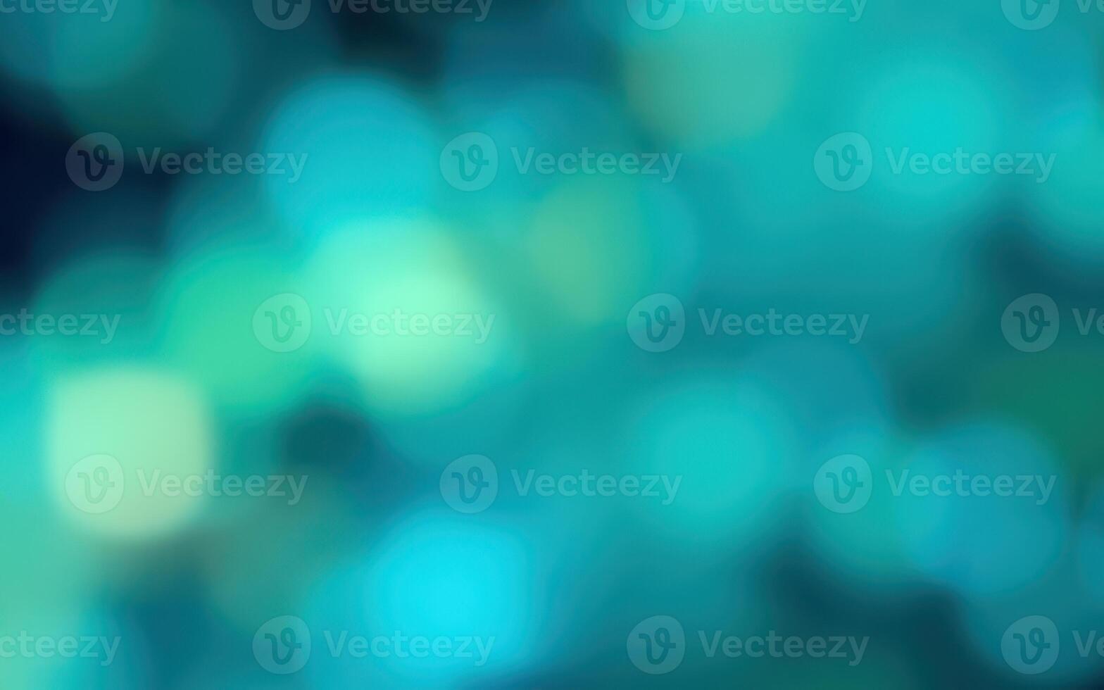 Vibrant colors create a soft, dreamy background with bokeh effect in varying shades of blue and green for artistic visuals photo