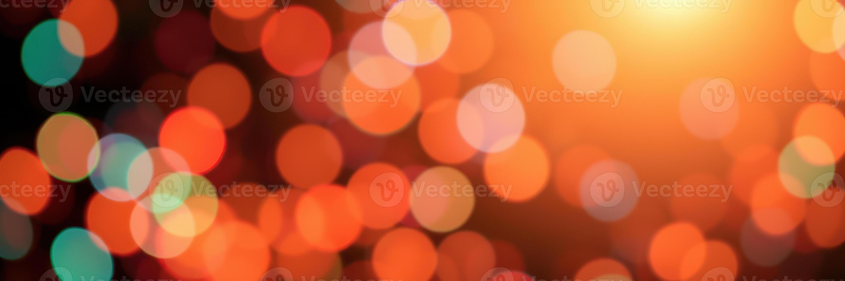 Colorful bokeh lights create a vibrant atmosphere during a festive event at night in an urban setting photo