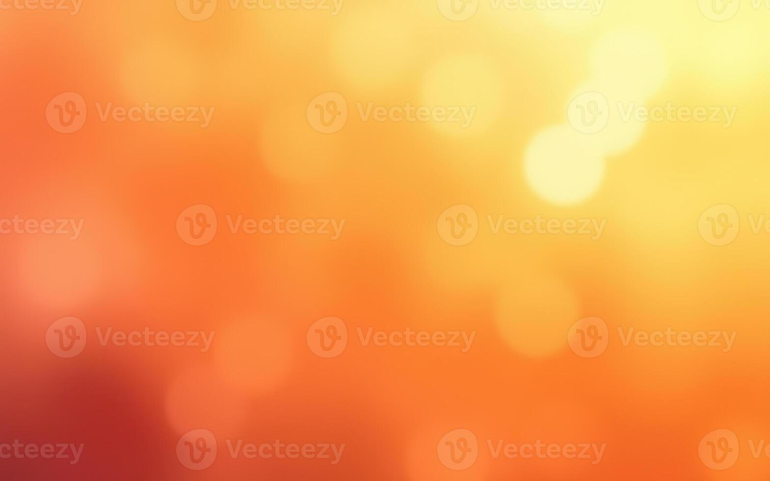 Colorful abstract background featuring warm orange and yellow tones with soft bokeh effects in a vibrant gradient photo
