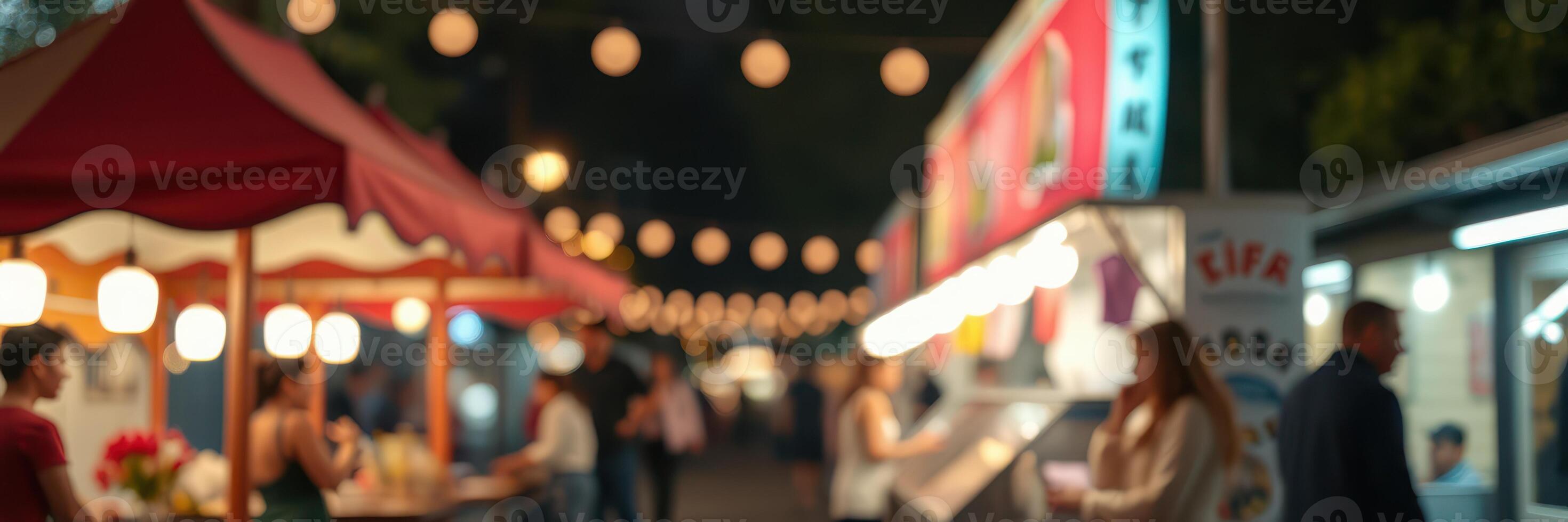 Colorful night market bustling with people enjoying street food and vibrant stalls during a summer evening photo