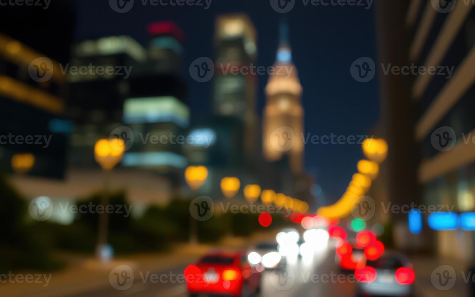 City skyline at night with blurred traffic lights and illuminated buildings in the background photo
