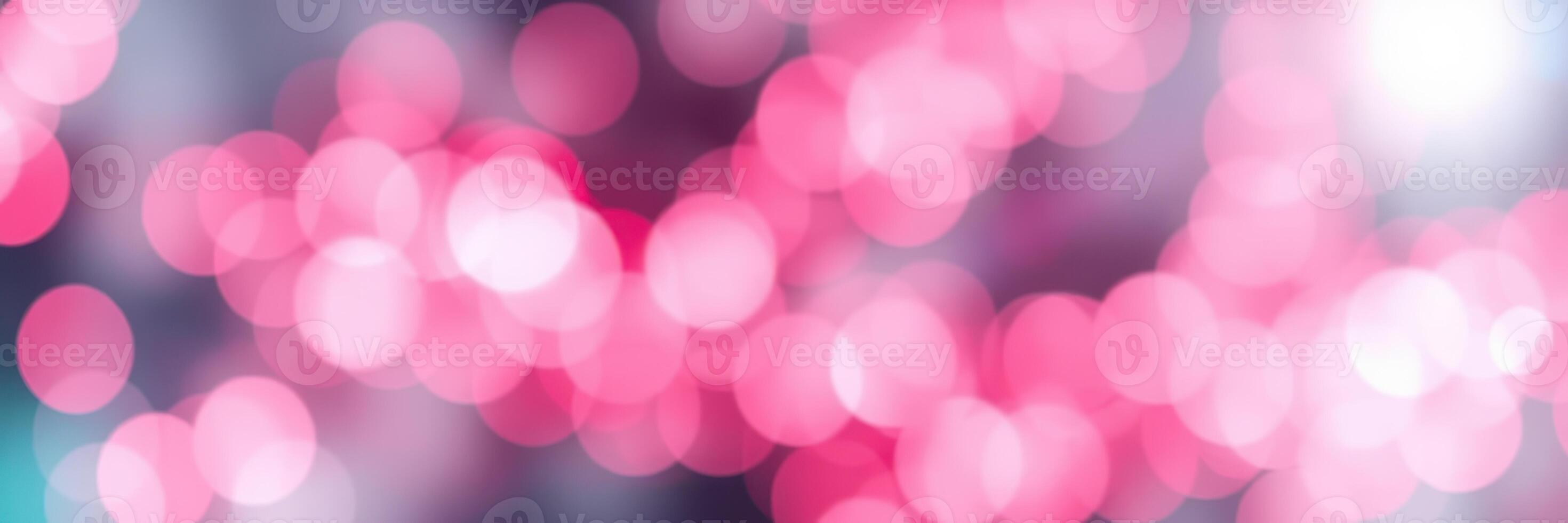 Bright pink bokeh lights create a vibrant atmosphere at a festive celebration in the evening photo