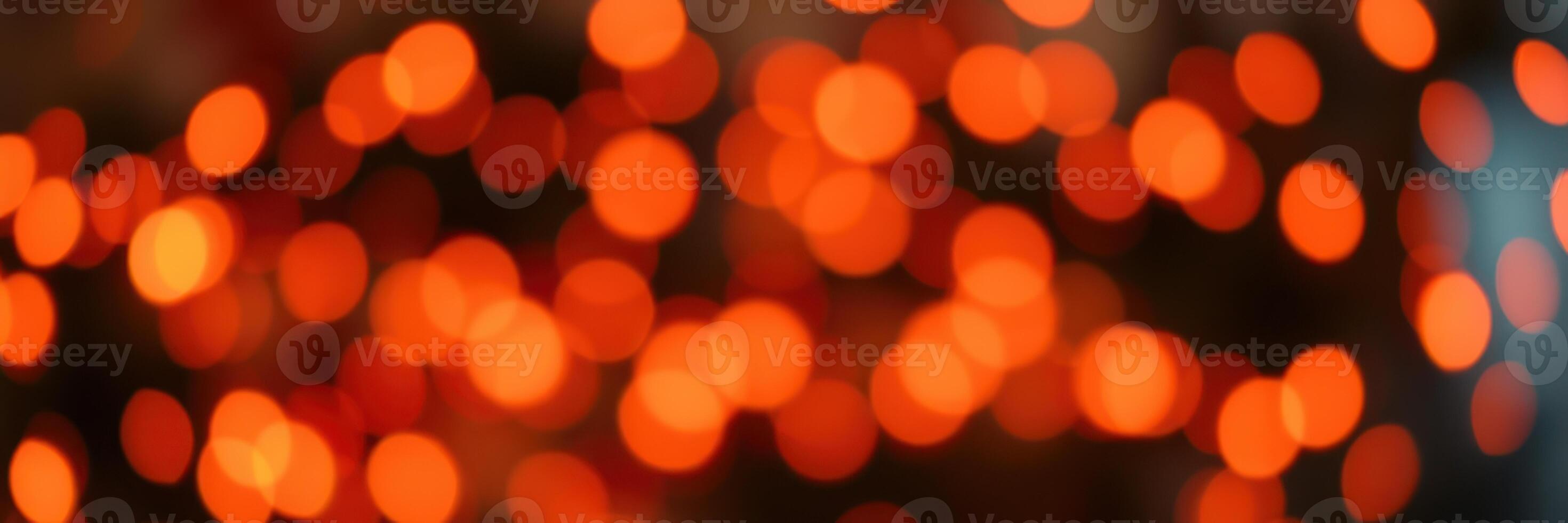 Warm orange lights create a festive atmosphere during a cozy evening gathering in a rustic setting photo