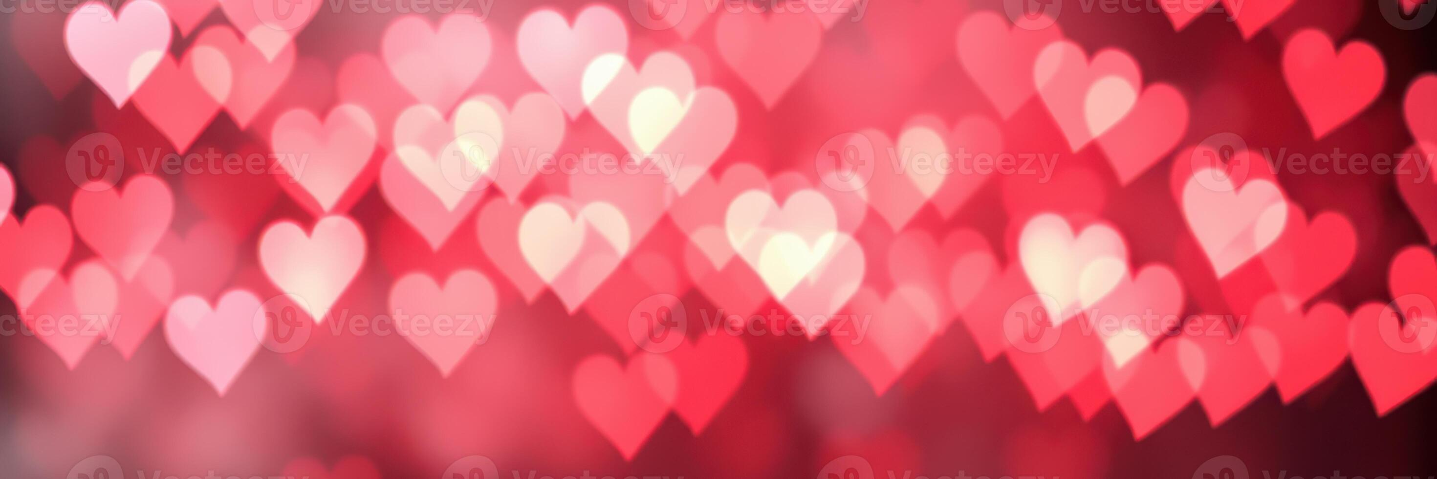 Vibrant heart shapes creating a romantic atmosphere in a blurred background during celebration or event photo