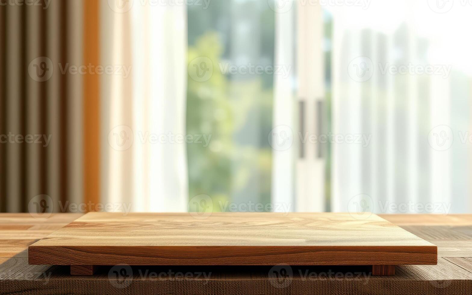 Wooden countertop with natural light streaming in from large windows in a cozy kitchen space photo