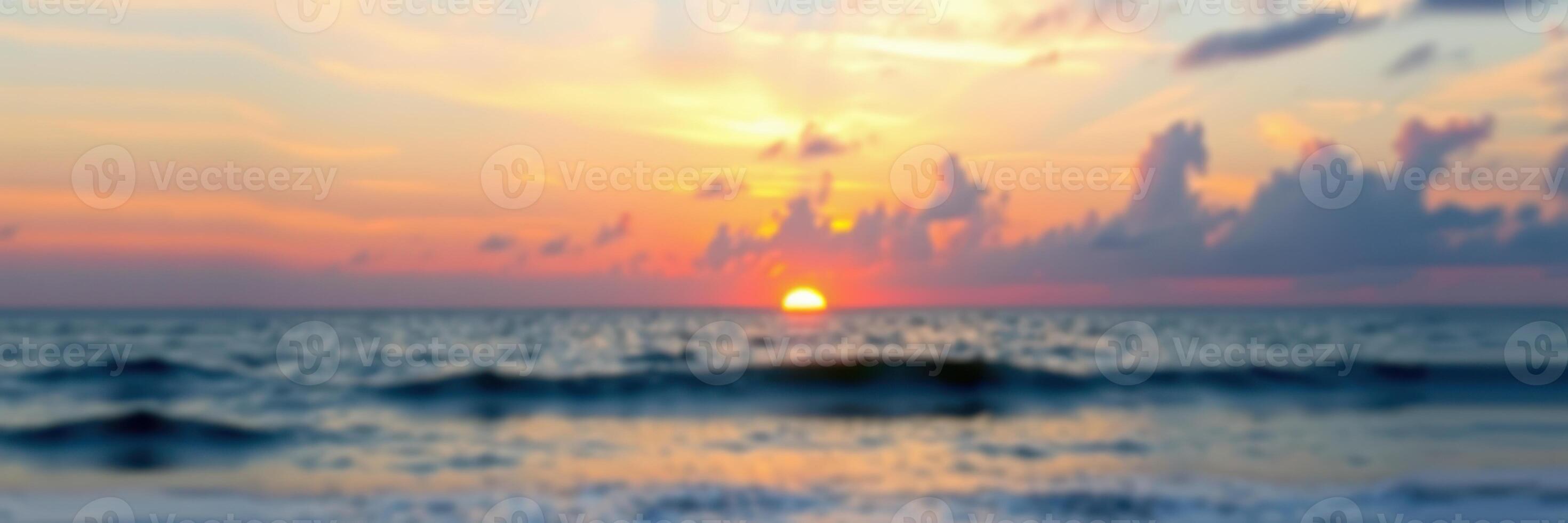 Vibrant sunset over the ocean with gentle waves and colorful sky at dusk photo