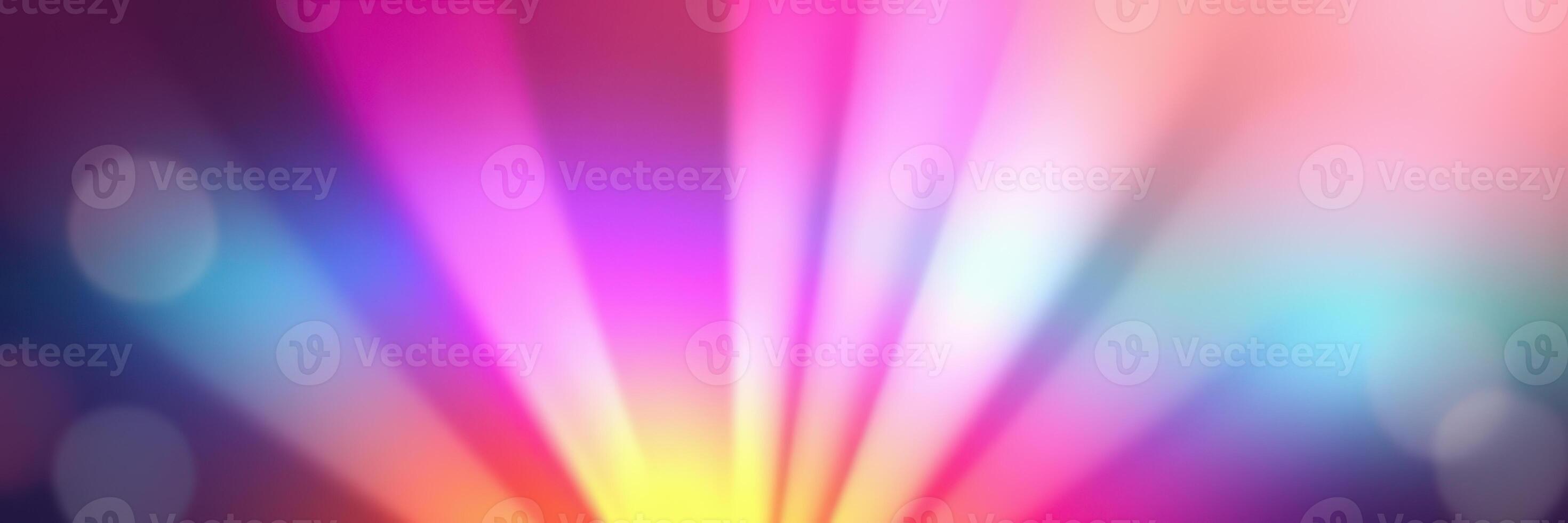 Colorful light rays create a vibrant atmosphere in a creative space during evening hours photo