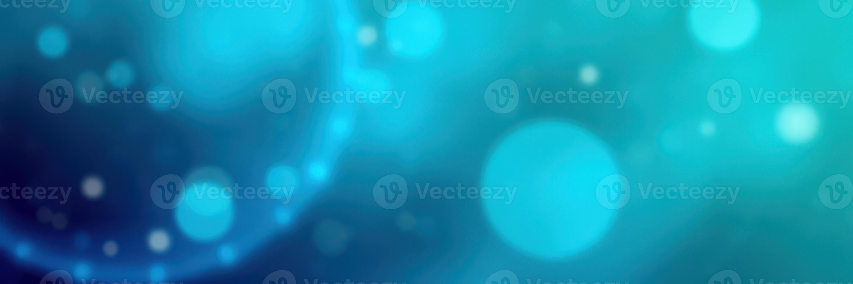Colorful abstract background featuring blue and teal orbs with soft glowing effects in a dreamy atmosphere photo