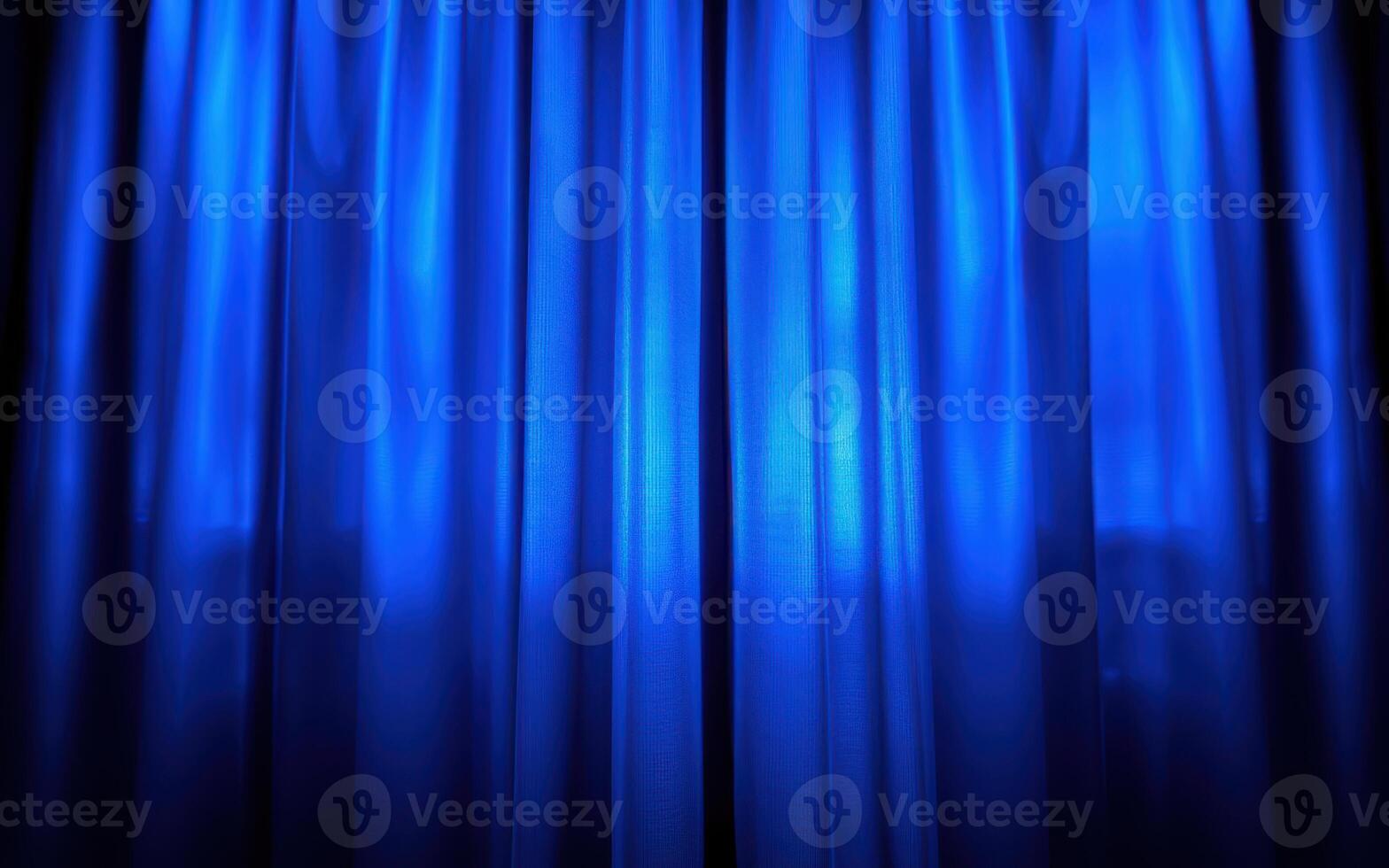 Beautiful blue curtains elegantly flowing in soft light at a theater venue during a performance photo