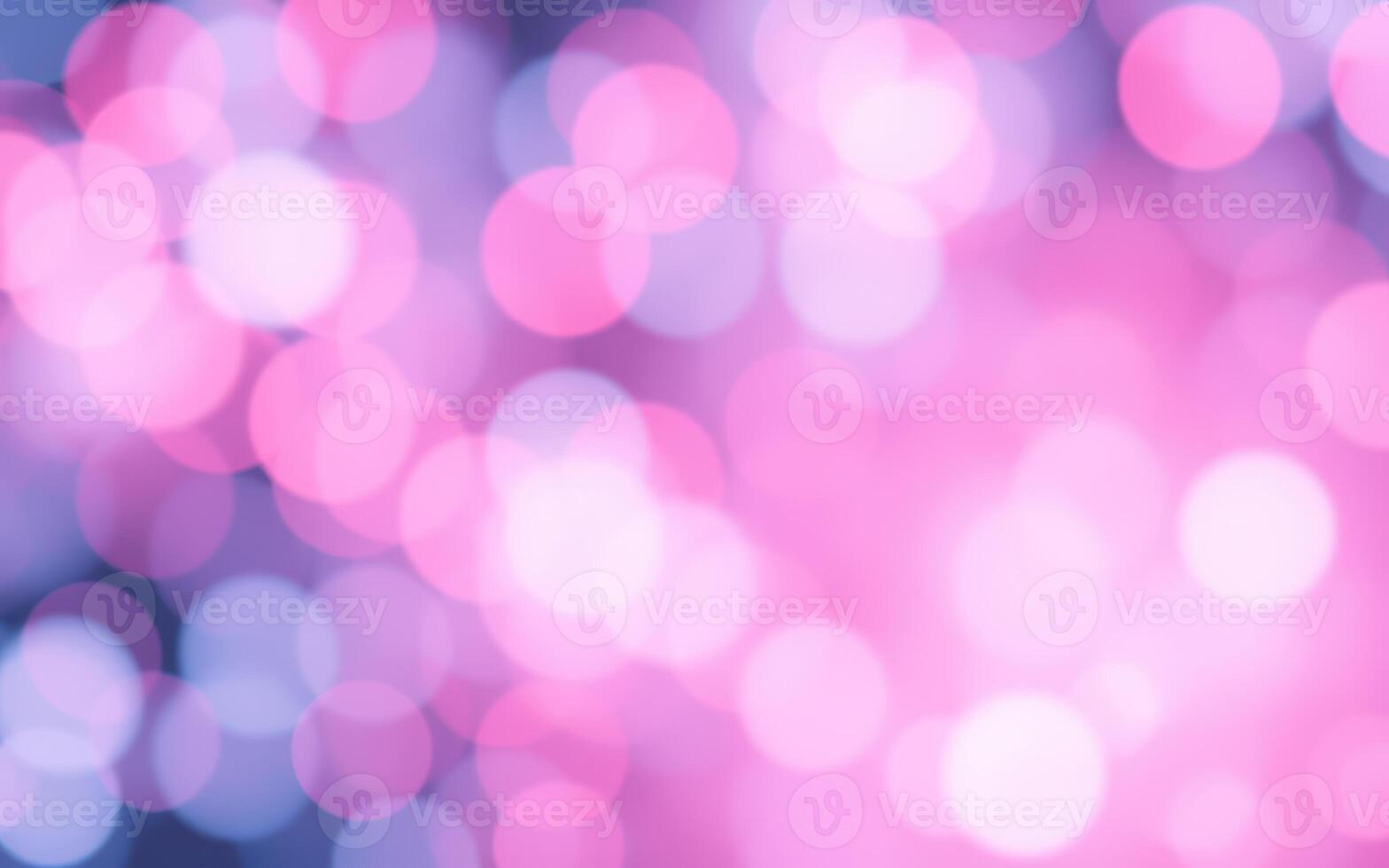 Vibrant bokeh lights create a dreamy atmosphere in soft pink and blue tones during a nighttime event photo