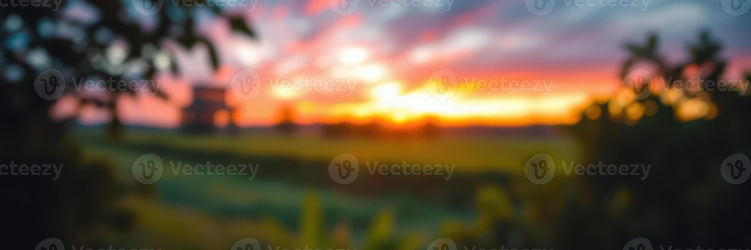 Beautiful sunset over a serene landscape with vibrant colors and soft clouds photo