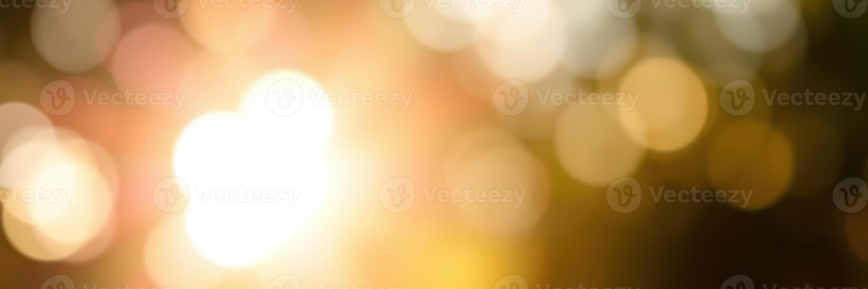 Beautiful golden bokeh lights creating a warm atmosphere during a sunset in a serene outdoor setting photo