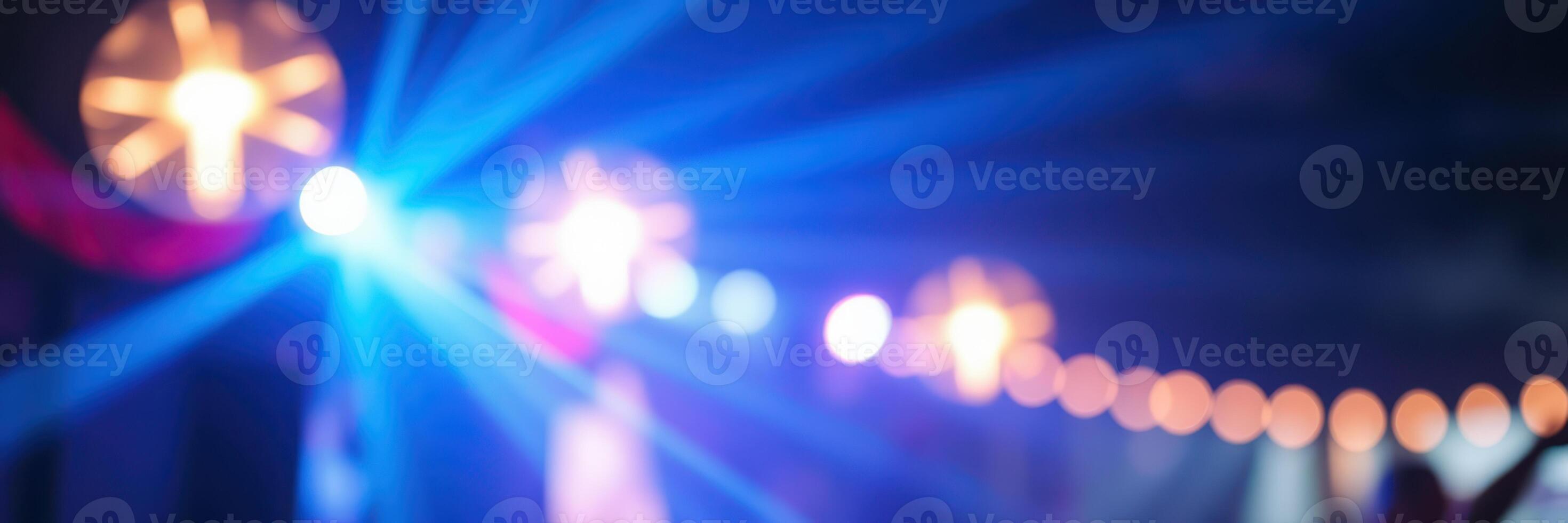 Colorful lights illuminate a festive atmosphere at a night celebration event with vibrant visual effects photo