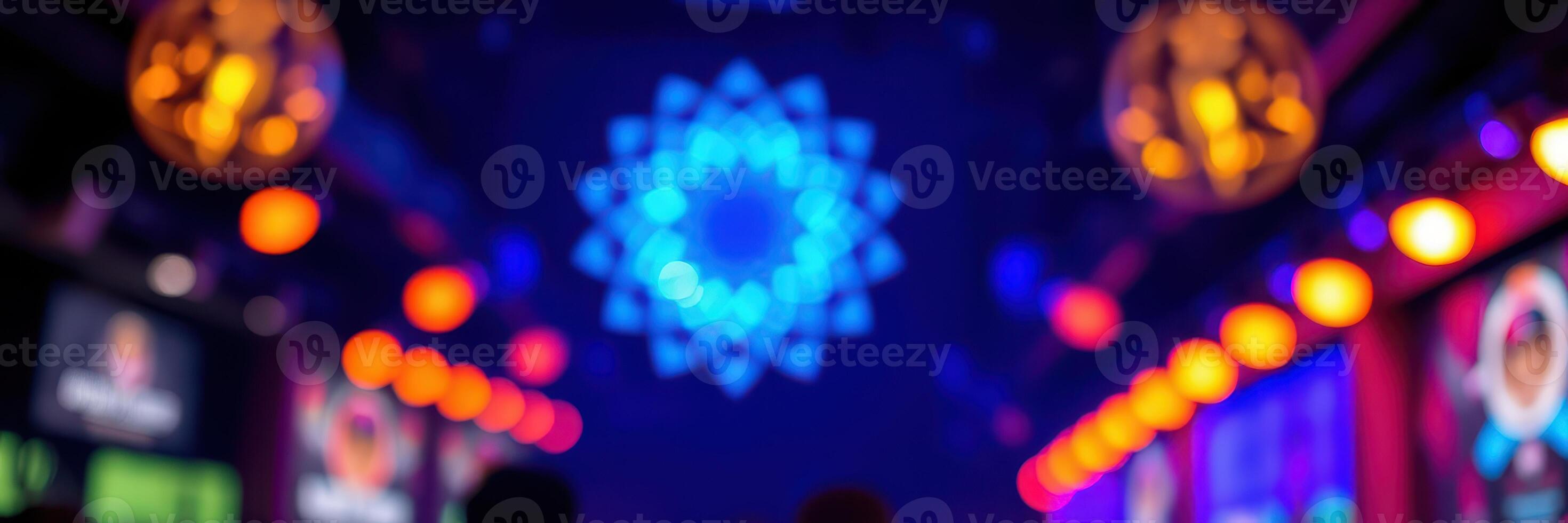 Colorful lights create a vibrant atmosphere in a lively indoor venue during a late-night event photo